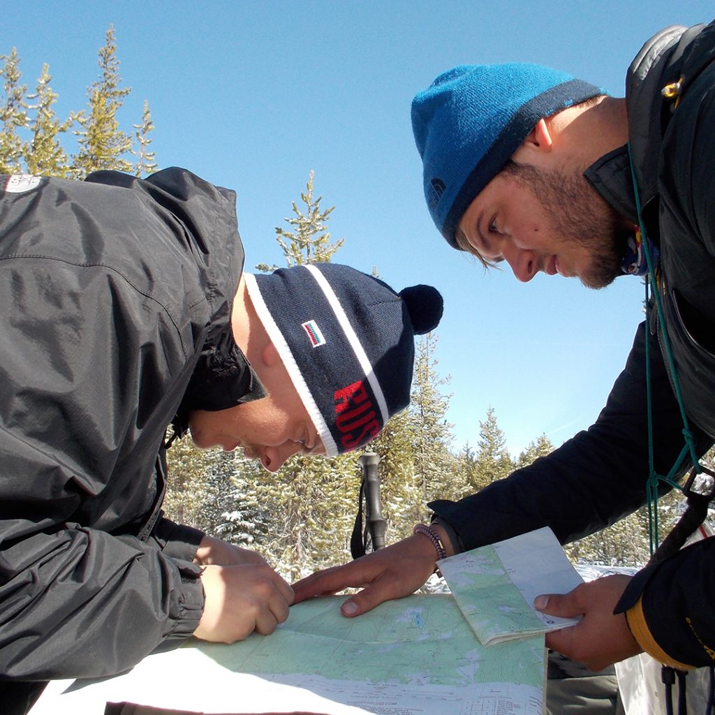 Reading a map on an Outward Bound expedition