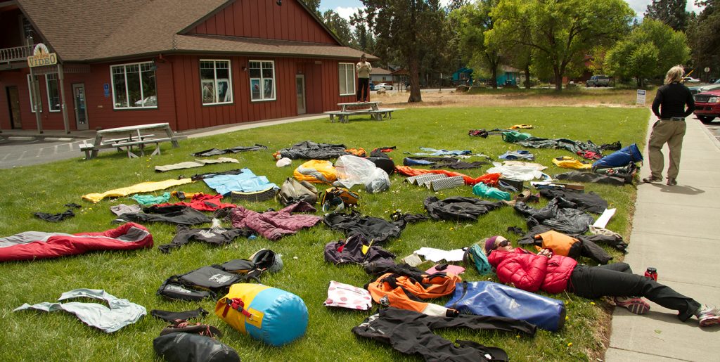 Photo shows the prep for a "duffle shuffle" before an Outward Bound expedition.