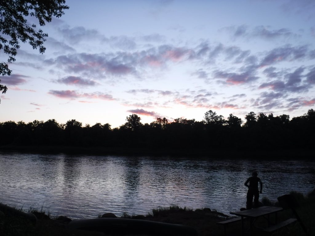 A crisp dawn breaks on the Namekagon River, right as students begin their day of travel on the St. Croix Riverway Canoeing & Rock Climbing course.