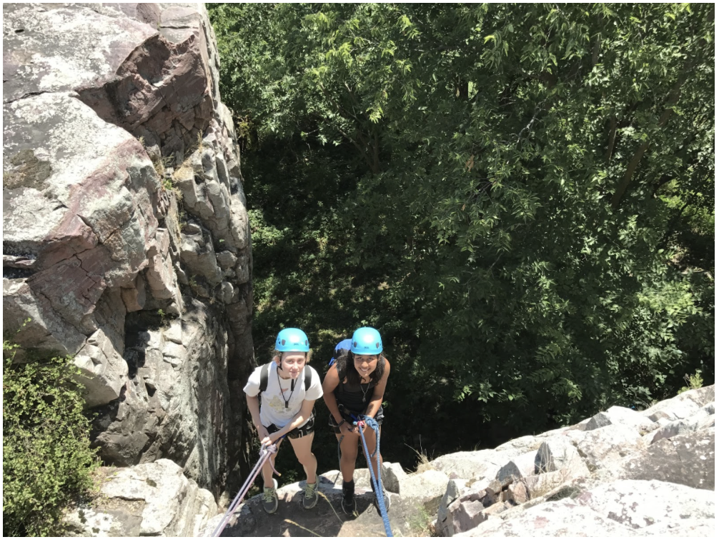 Students learn to rappel during the rock climbing section of course.