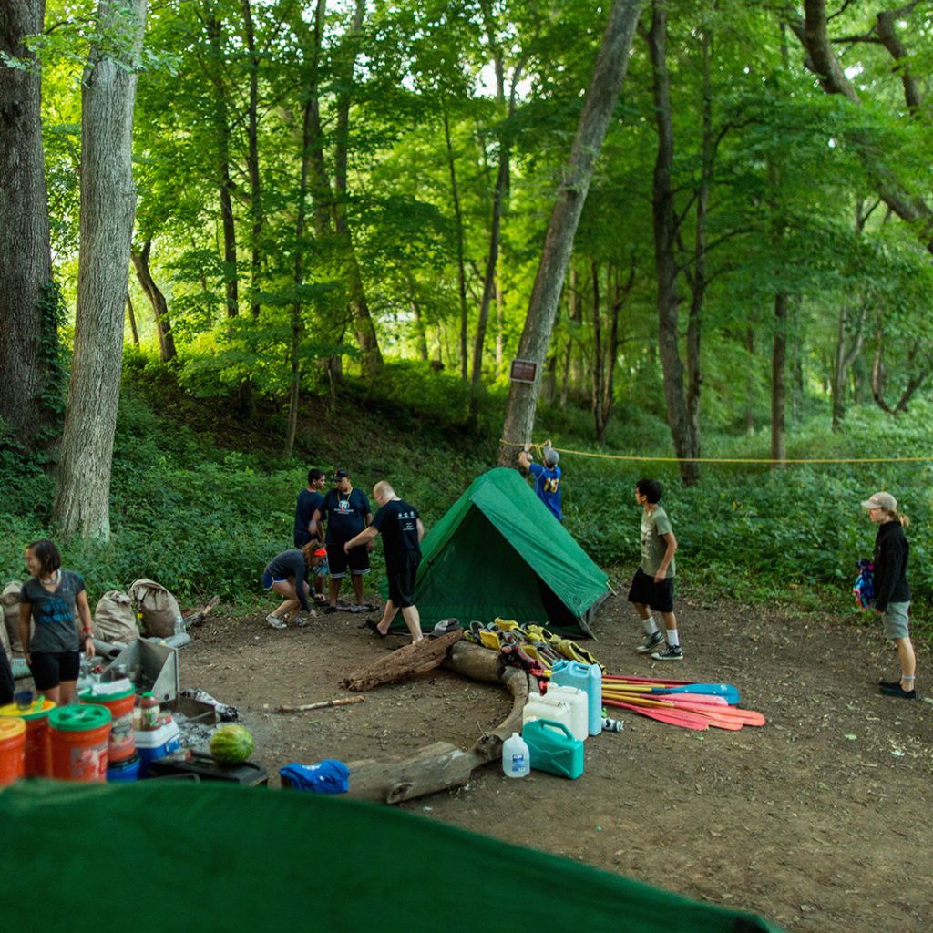 Students use teamwork and communication to set up camp for the night. Photo by Ryan Harris.