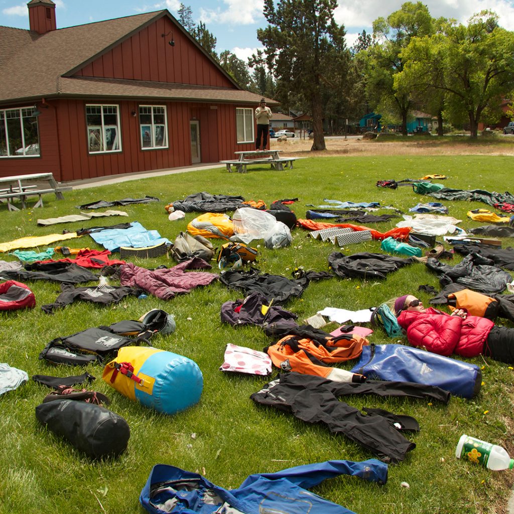 Photo shows a typical "duffle shuffle" where students get their packs ready for their expedition.
