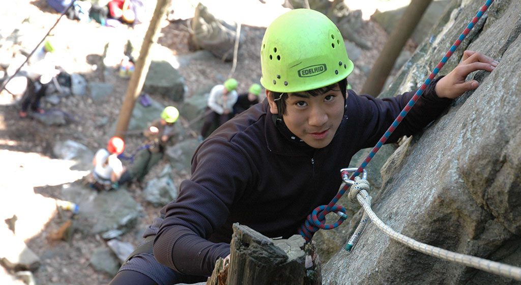 Photo shows a student on the Delaware Water Gap Backpacking & Rock Climbing for Grieving Teens expedition.