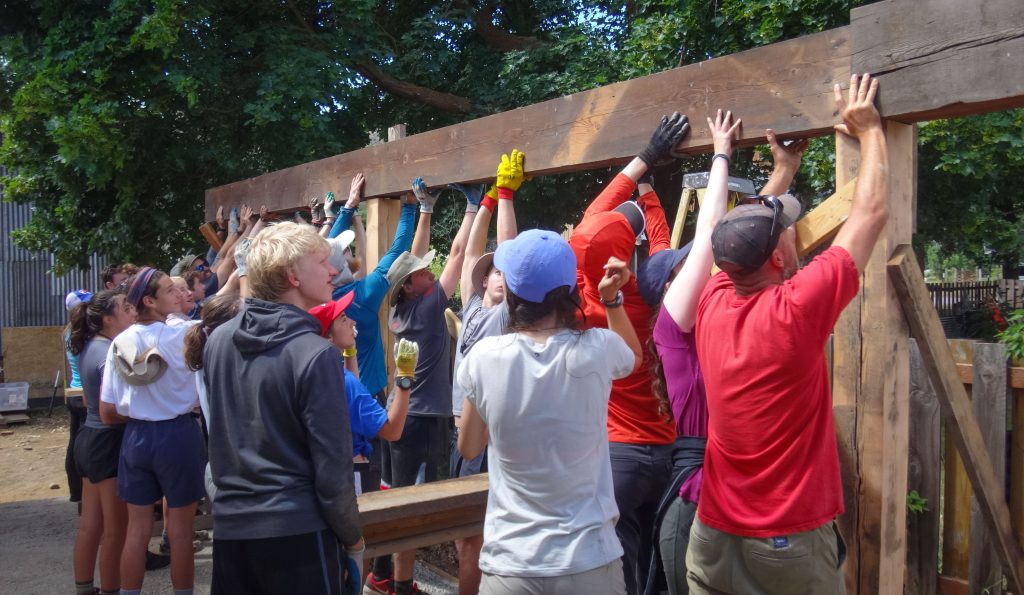 Photo shows Outward Bound students completing a service project on an expedition, courtesy of Luke O'Neill.