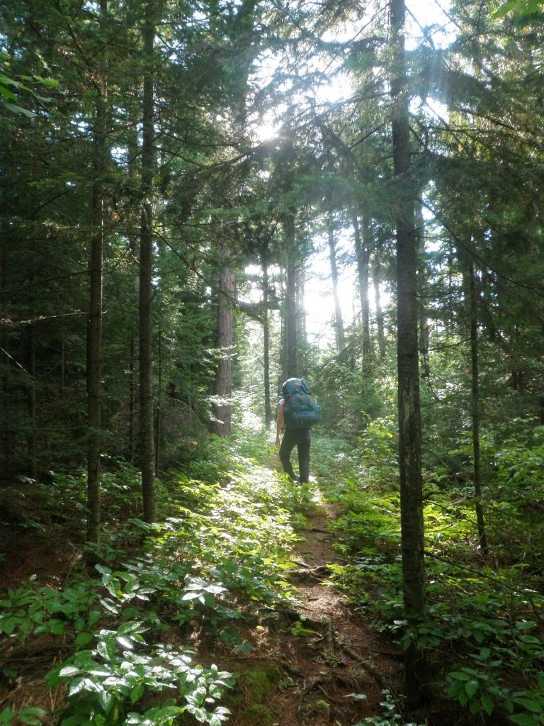 Photo shows a solo backpacker on an Outward Bound course, courtesy of Samuel Del Favero.