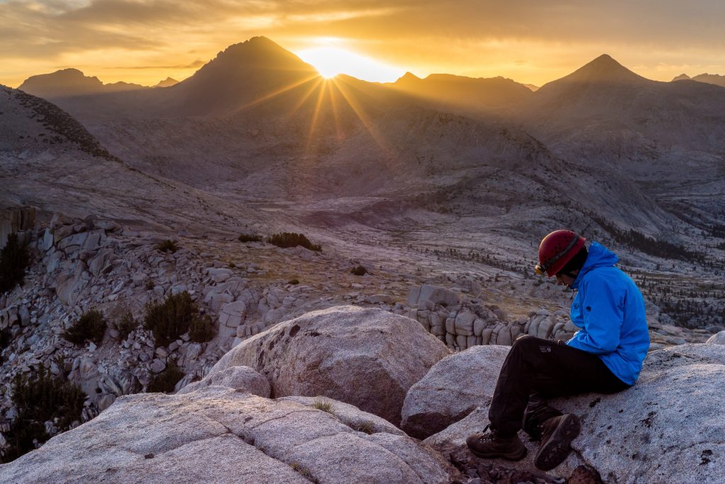 Photo shows a student filling out their journal on a 30-day Pathfinder expedition, courtesy of Rikki Dunn.