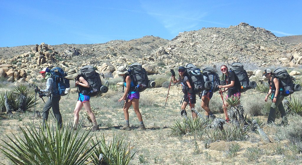 Photo shows Outward Bound students backpacking in Big Bend, Texas. By Emma Rapp.